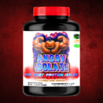 Coregenix Lab Angry Isolate whey protein container with muscular pumpkin mascot, cookies and cream flavor, highlighting strength and organic formulation.